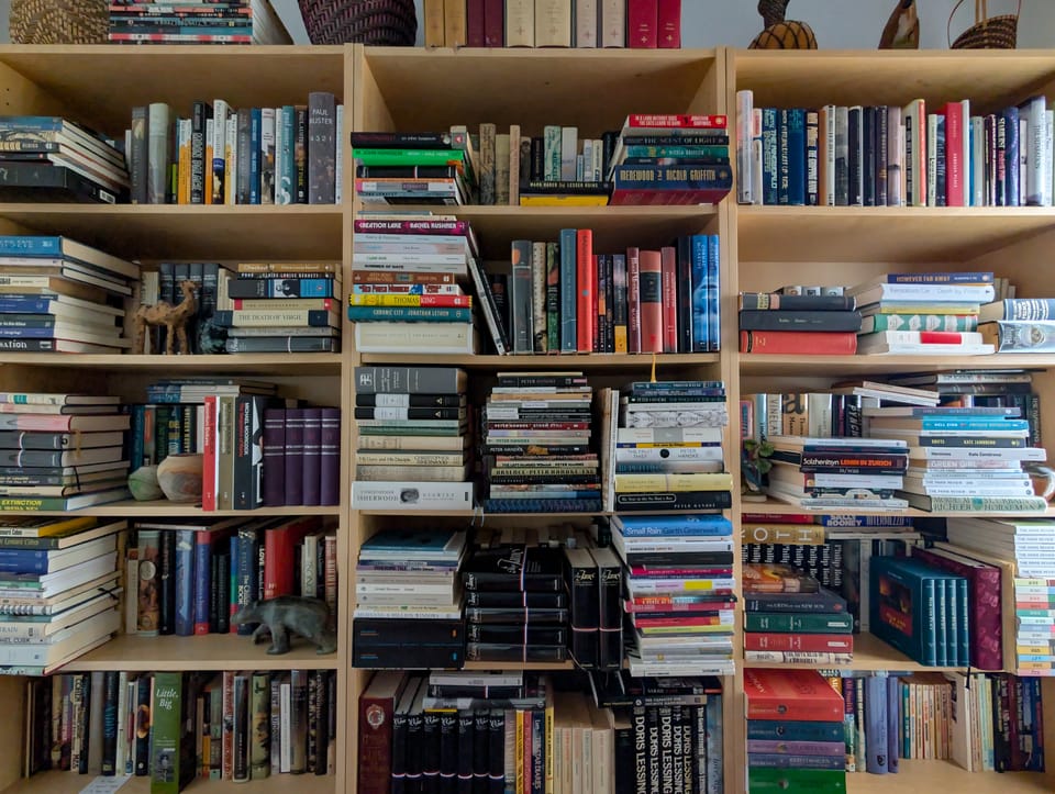 Crowded bookshelves.